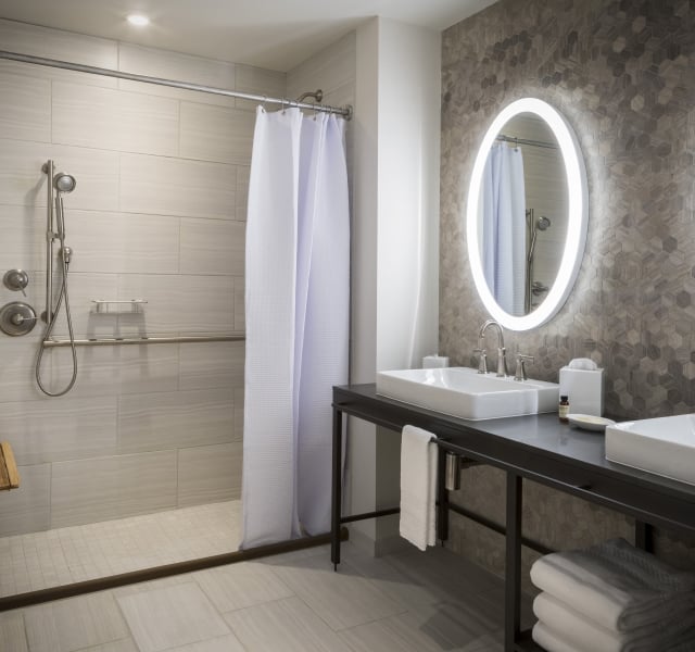 ADA room bathroom with accessible bar / roll in shower