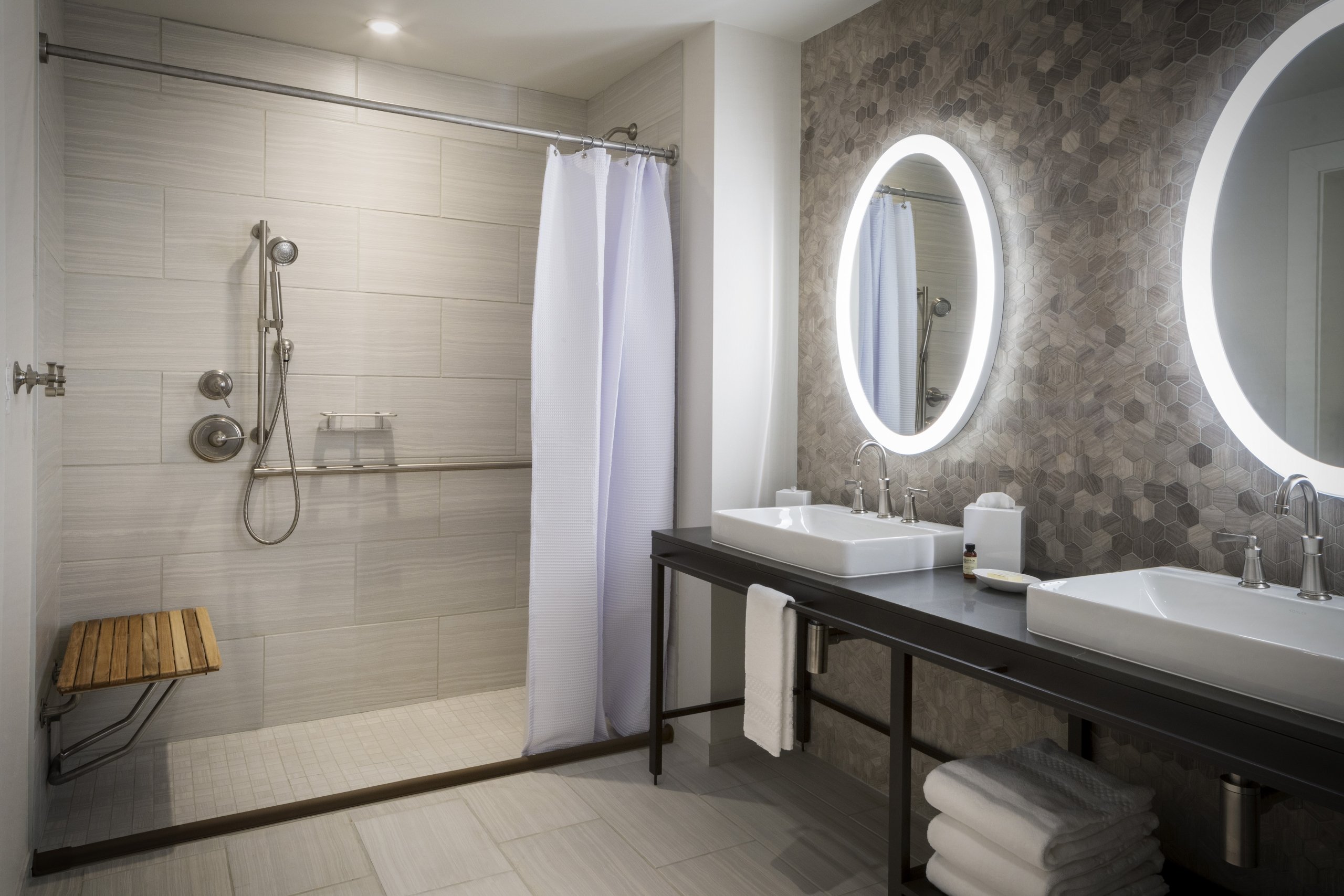 ADA room bathroom with accessible bar / roll in shower