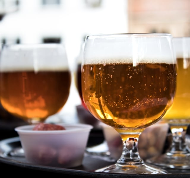 Three cups of belgium beer, amber and white