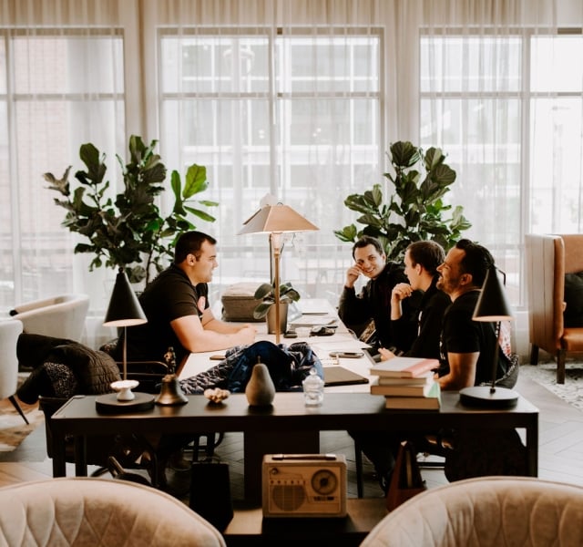 business group team meeting at the elizabeth hotel at a desk with table lamp