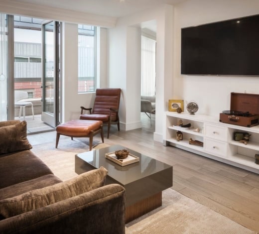 A room at the Elizabeth Hotel, with a large media console featuring a vinyl record player