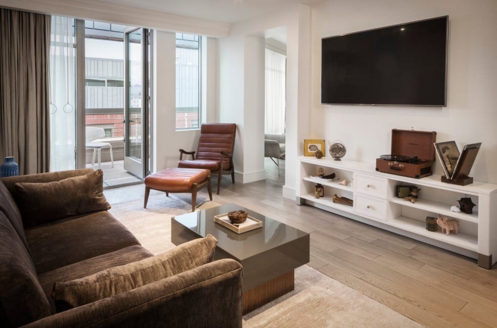 A room at the Elizabeth Hotel, with a large media console featuring a vinyl record player