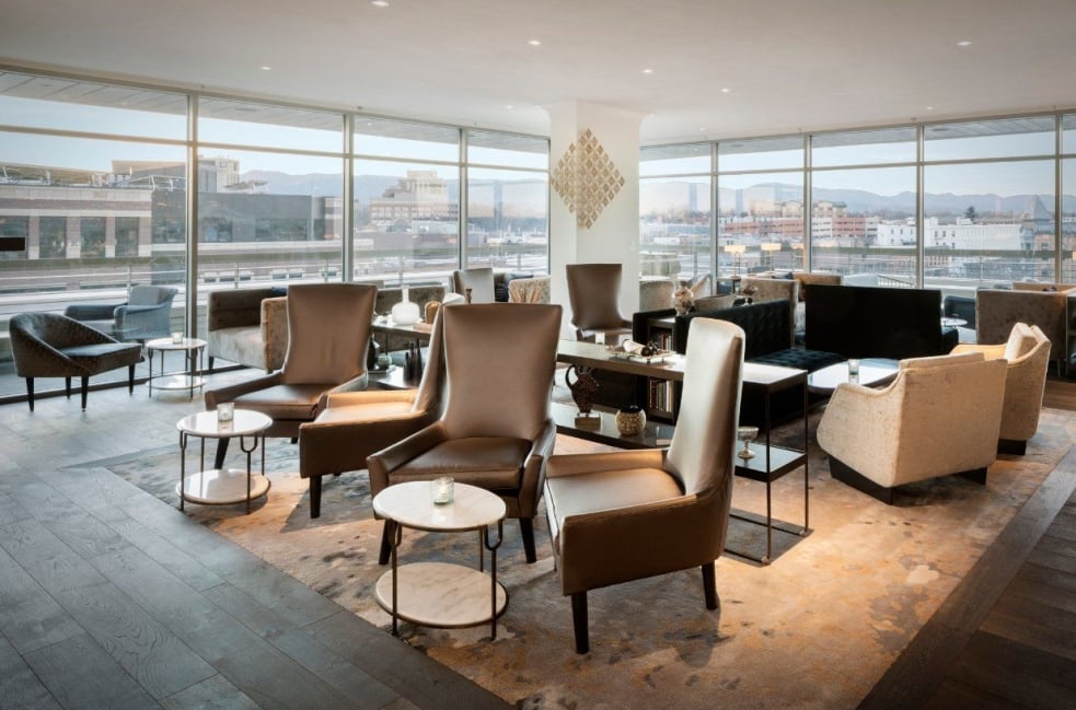 A comfortable seating area with high-backed lounging chairs at the Sunset Lounge
