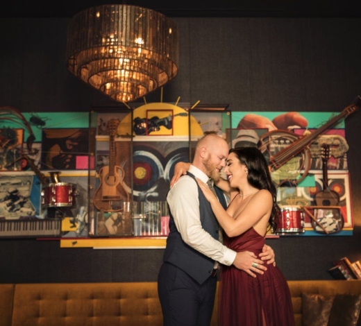 A couple slow dancing at a reception