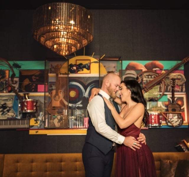 A couple slow dancing at a reception