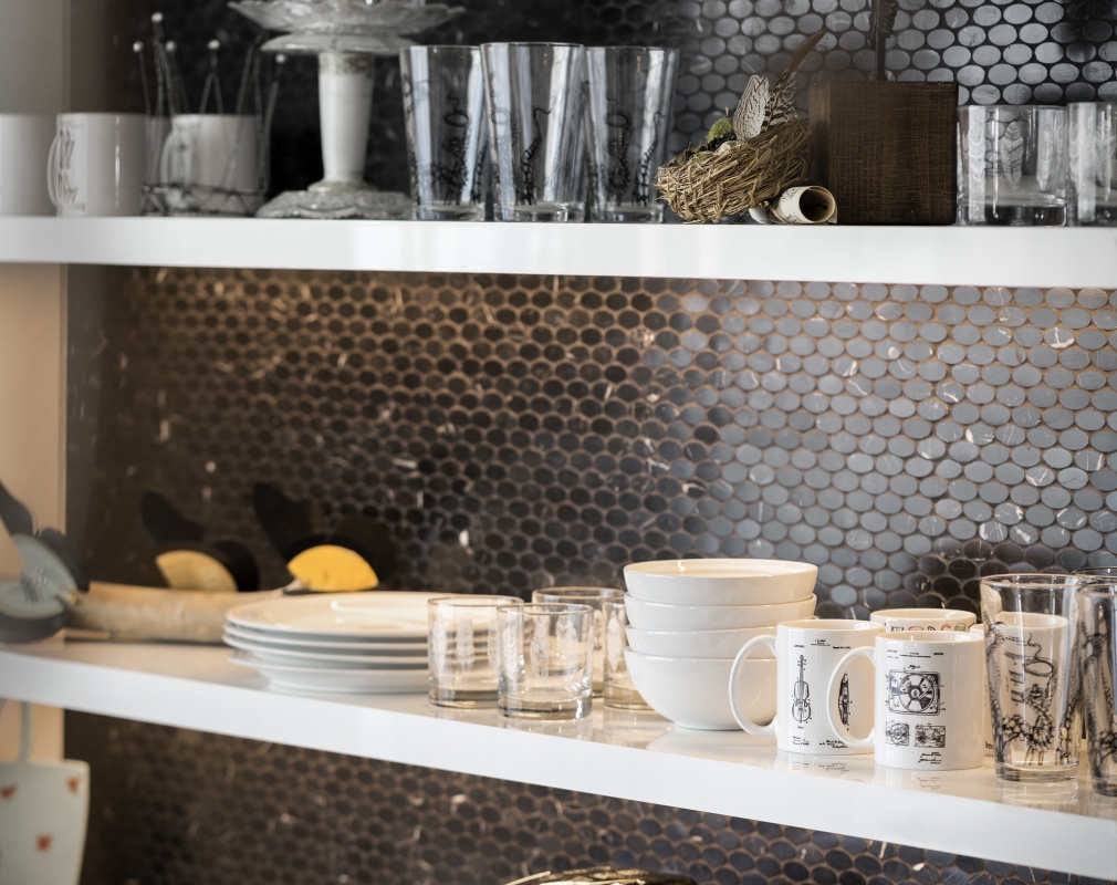 A shelf of glassware and dishes