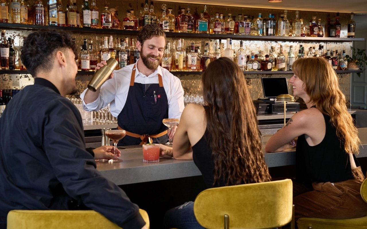 Bartender making drinks at The Sunset Lounge