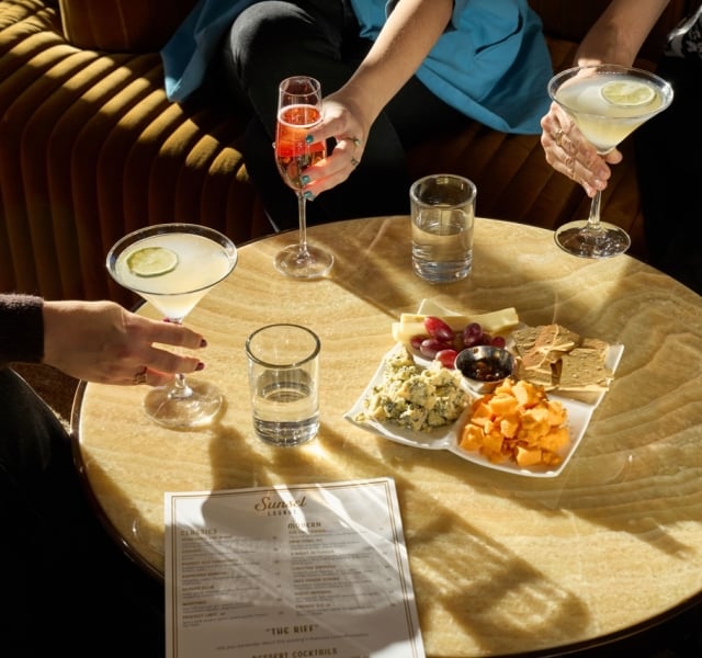 Assortment of beverages and charcuterie platter at The Sunset Lounge