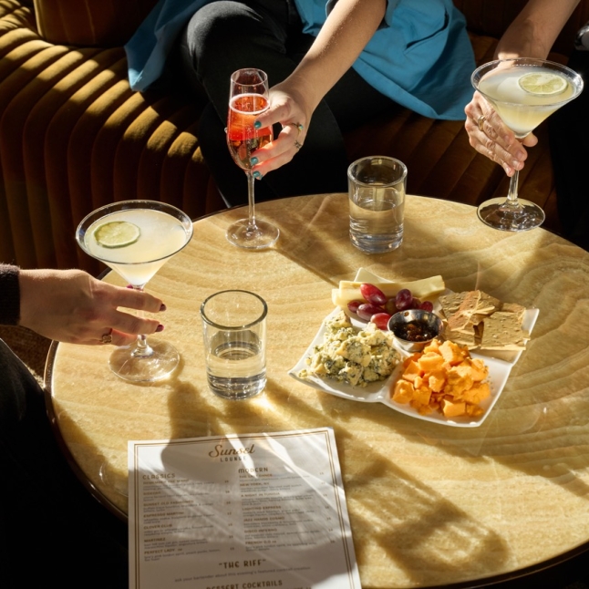 Assortment of beverages and charcuterie platter at The Sunset Lounge