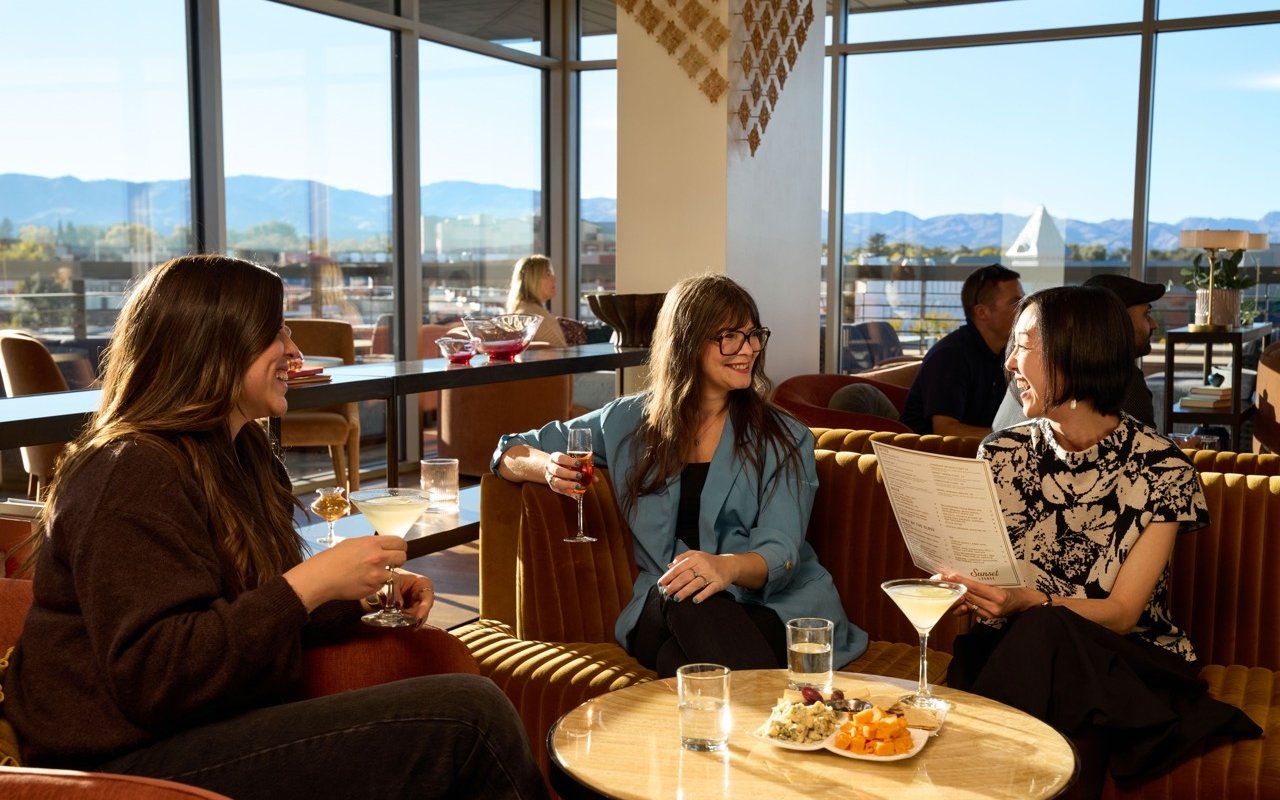 Group enjoying Wine and spirits at The Sunset Lounge