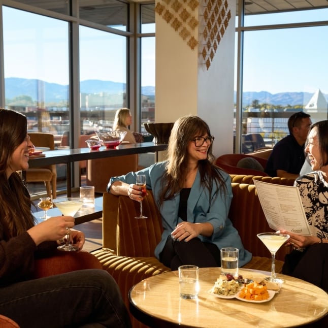 Group enjoying Wine and spirits at The Sunset Lounge
